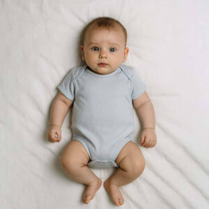 A toddler is wearing a pure grey classic baby bodysuit