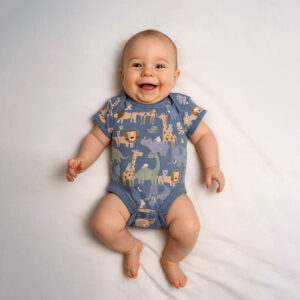A toddler is wearing a safari luxe playtime baby bodysuit
