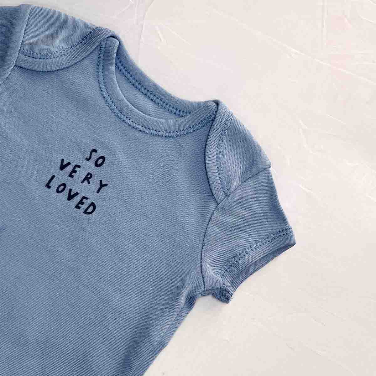 So very loved baby bodysuit close-up view