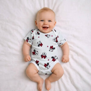 A toddler is wearing a Minnie Mouse Little Love Bodysuit