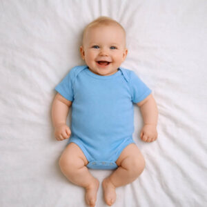 A toddler is wearing a Morning Sky Bodysuit