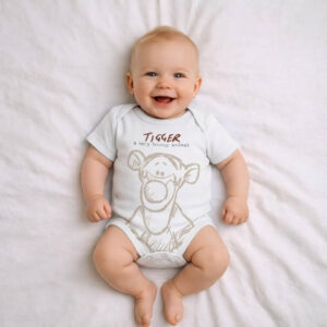 A toddler is wearing a Tigger Bouncy Days Bodysuit