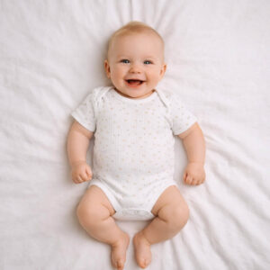 A toddler is wearing a Twinkle Star Ribbed Bodysuit