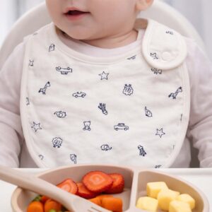 Ivory safari print baby bib worn by a baby during feeding time