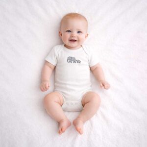 Baby wearing a baby elephant embroidered bodysuit with soft ribbed fabric