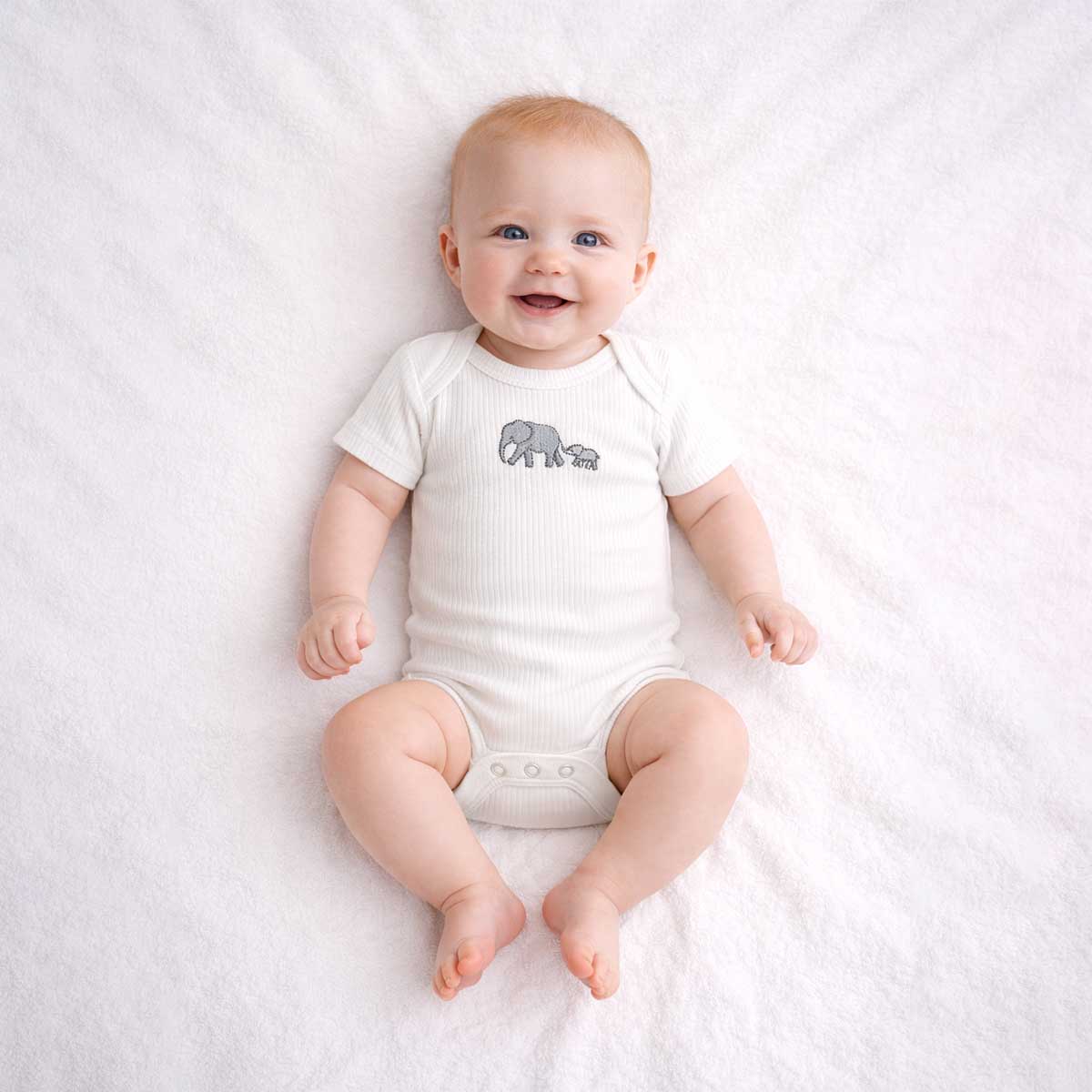 Baby wearing a baby elephant embroidered bodysuit with soft ribbed fabric