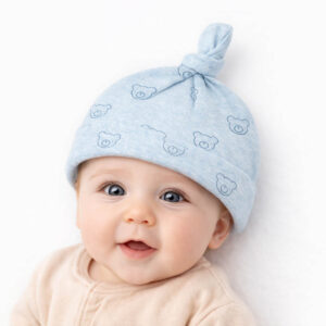 baby knot hat with soft blue teddy bear print worn by a newborn