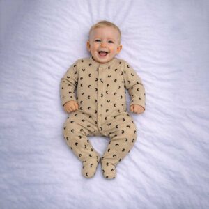 Baby neutral sleepsuit in beige with crescent print