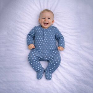 Baby star sleepsuit in blue with white star print