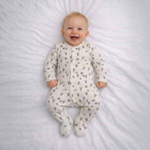 Baby wearing a baby teddy space sleepsuit with cute teddy bears and space print