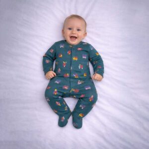 Baby sleepsuit with colourful vehicle and transport print