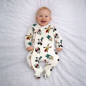 Cream baby sleepsuit with cartoon character print