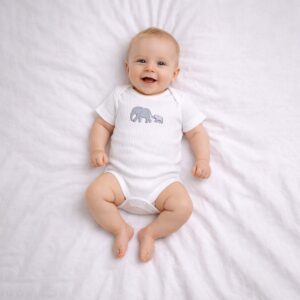 Elephant embroidered baby bodysuit worn by a baby during everyday wear