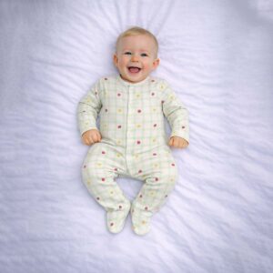 Fruit gingham baby sleepsuit worn by baby showing cute fruit and check pattern