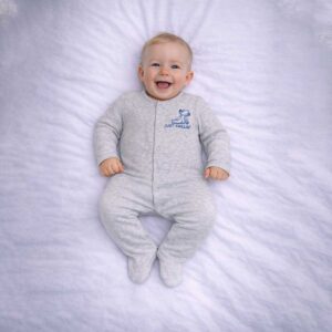 Just chillin baby sleepsuit worn by baby showing cute slogan and relaxed design