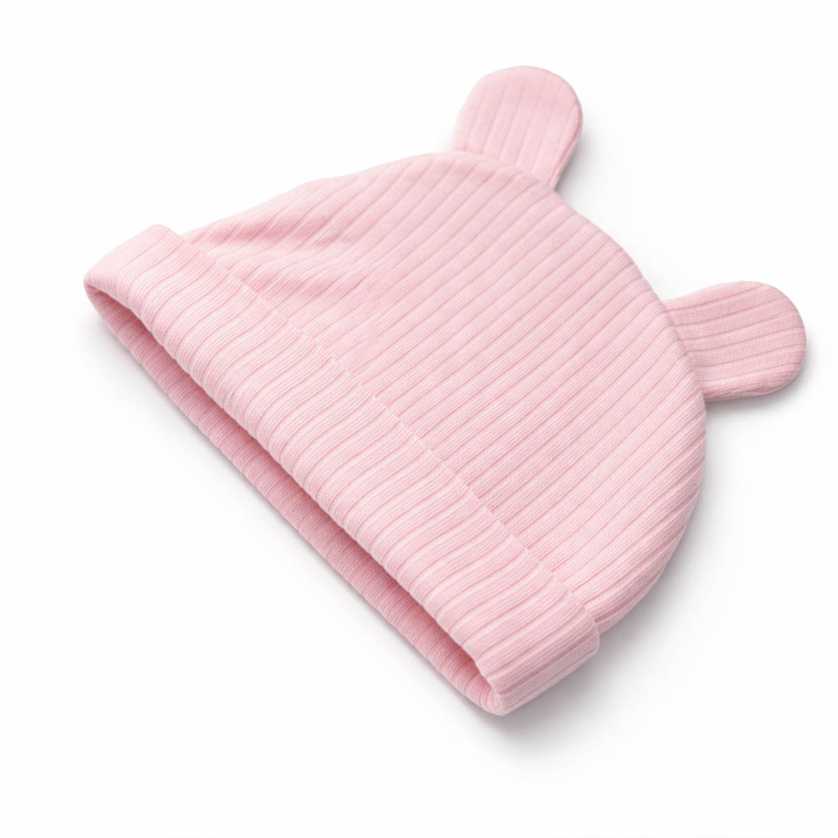 Soft pink newborn ribbed baby hat shown in studio flat lay