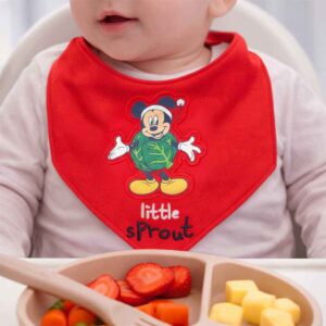 Red icon bandana baby bib worn by a baby during feeding time