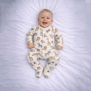 Safari animal print baby sleepsuit worn by baby showing cute animal illustrations